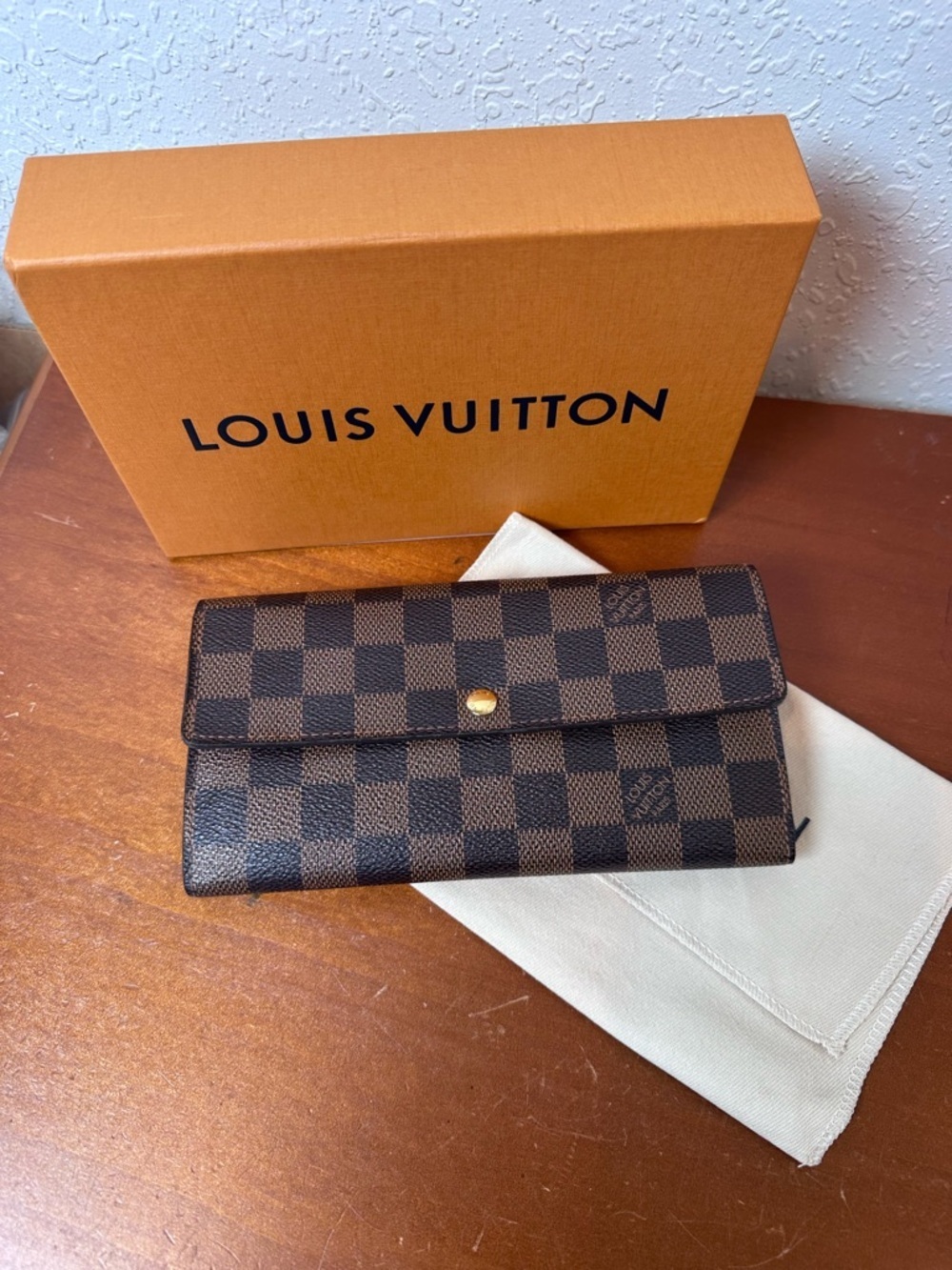Louis Vuitton Damier Ebene
Sarah Wallet